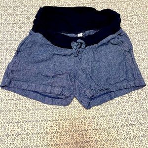 Blue linen maternity shorts.